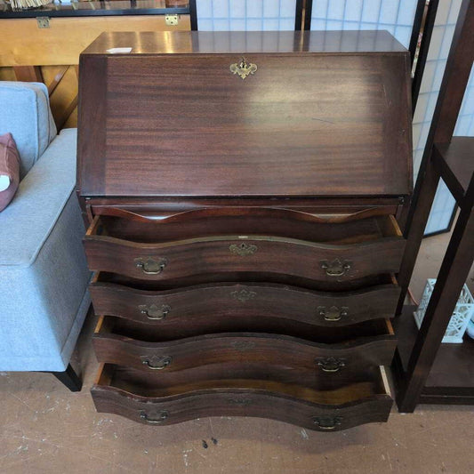 Wooden dresser with multiple drawers in a room setting