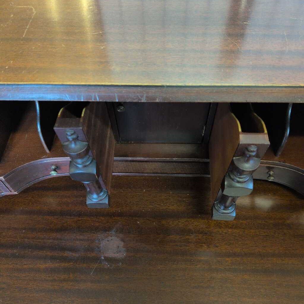 Wooden table with metal legs on a wooden floor