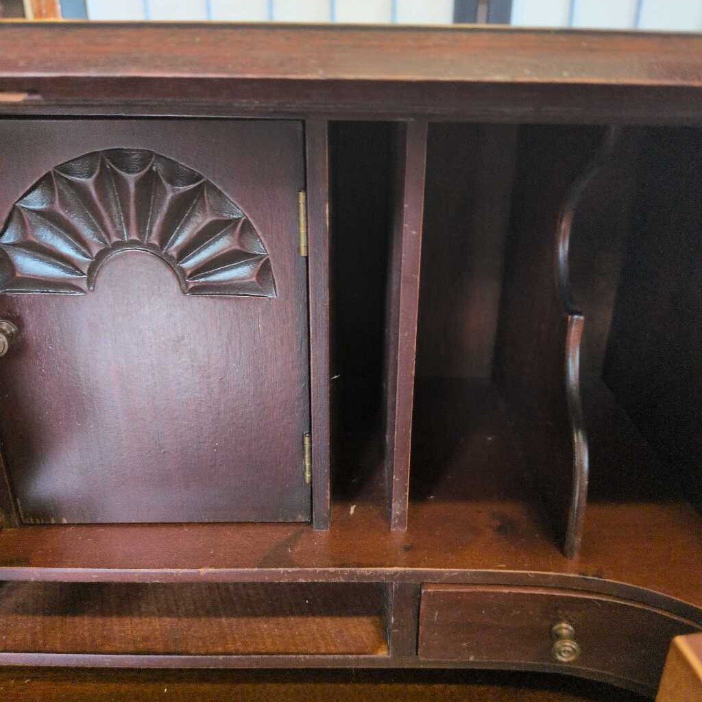 Wooden desk with decorative design on a blurred background