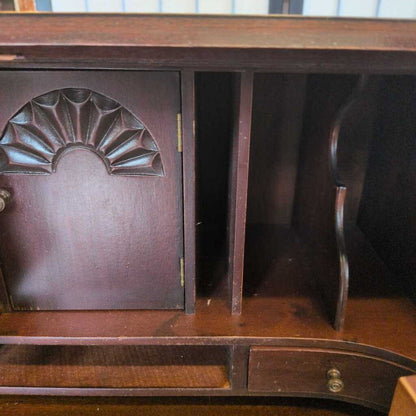 Wooden desk with decorative design on a blurred background
