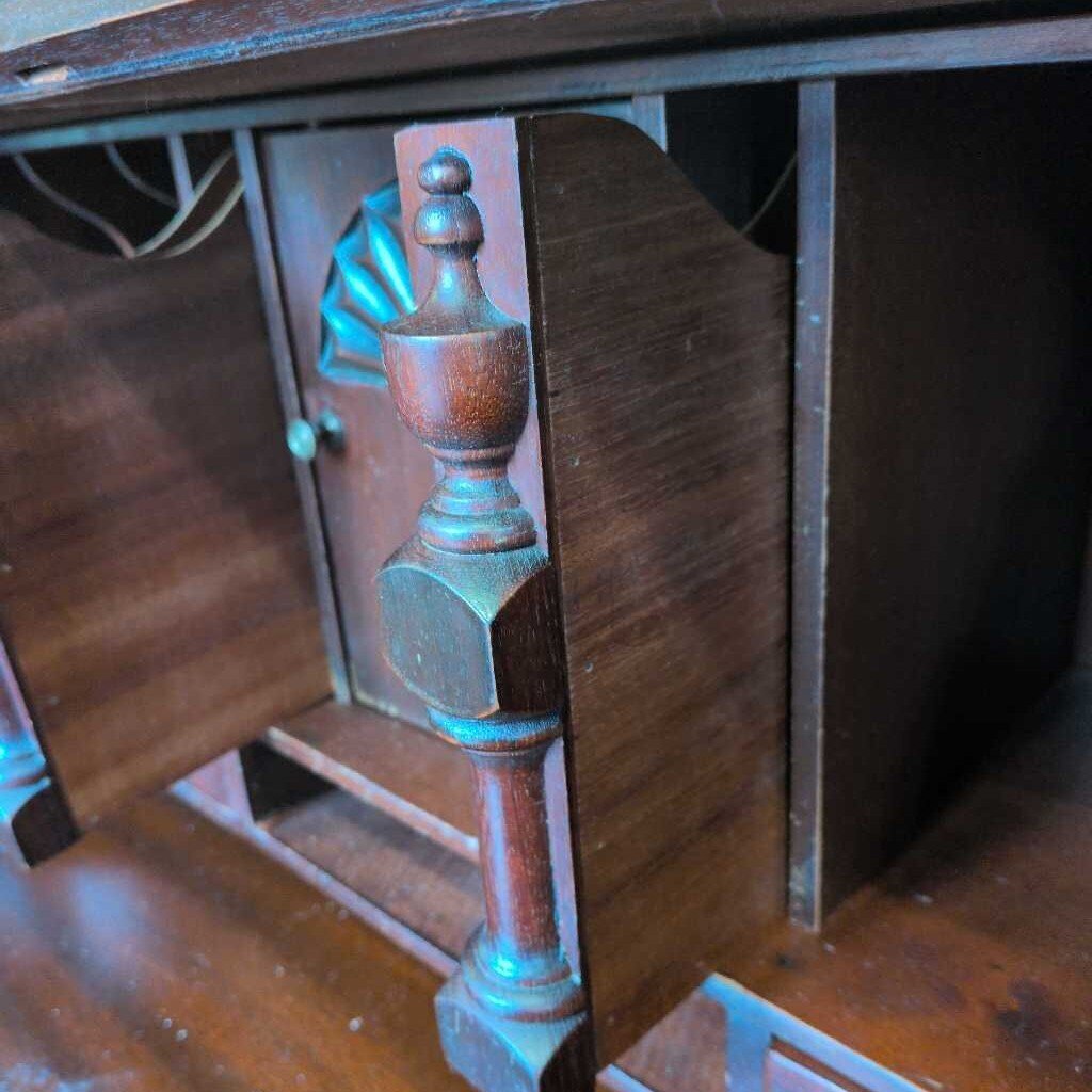 Close-up of a wooden cabinet with ornate detailing