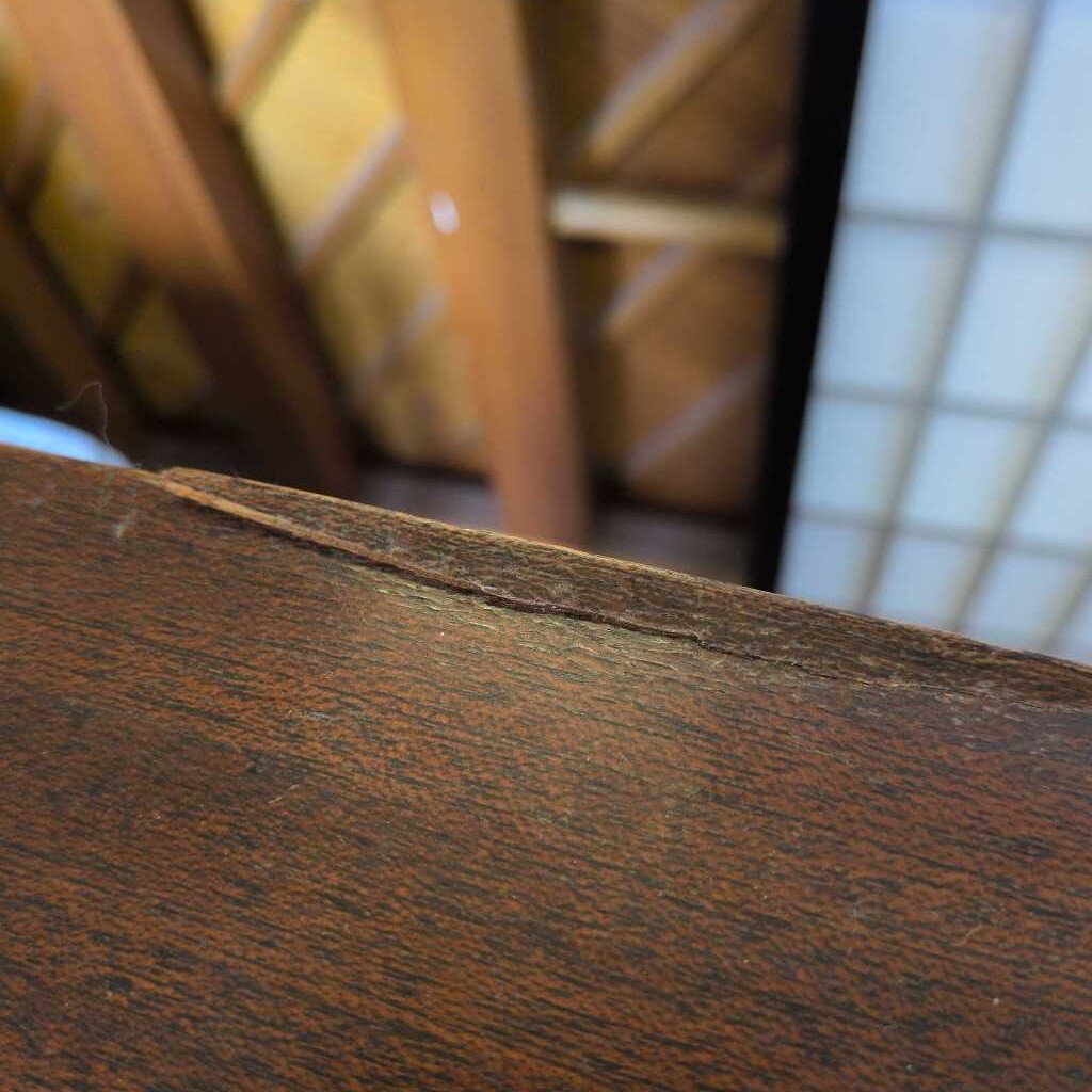 Close-up of a wooden surface with a blurred background