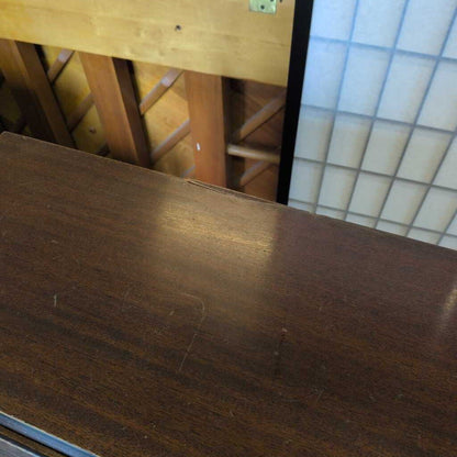 Close-up of a wooden surface with a blurred background