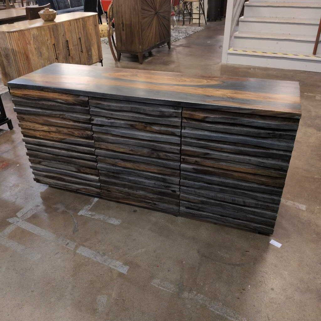 Wooden reception desk in a showroom setting