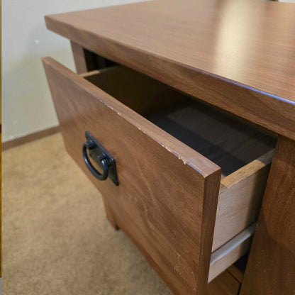 Wooden drawer with open drawer on a wooden cabinet