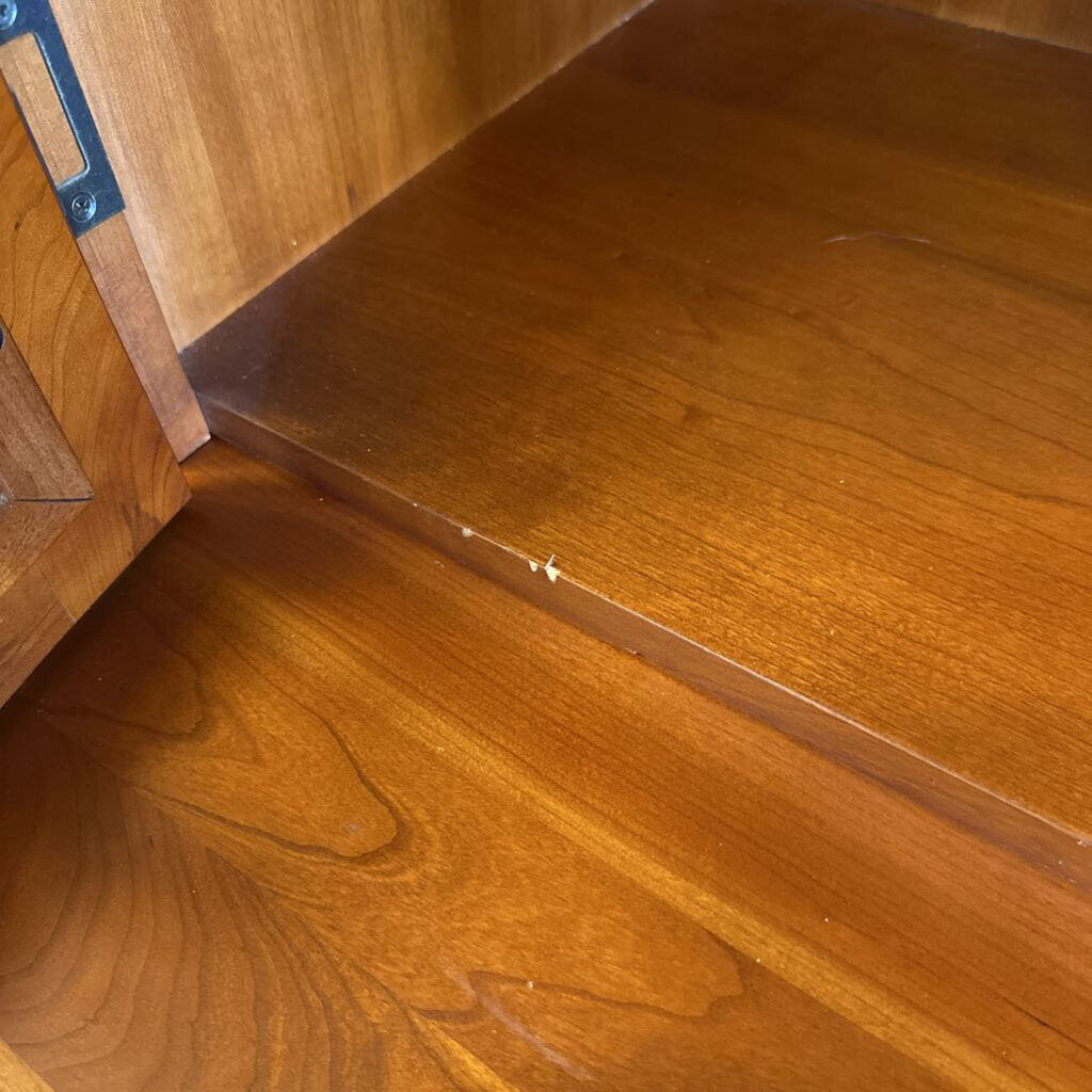 Close-up of a wooden surface with a clear plastic strip