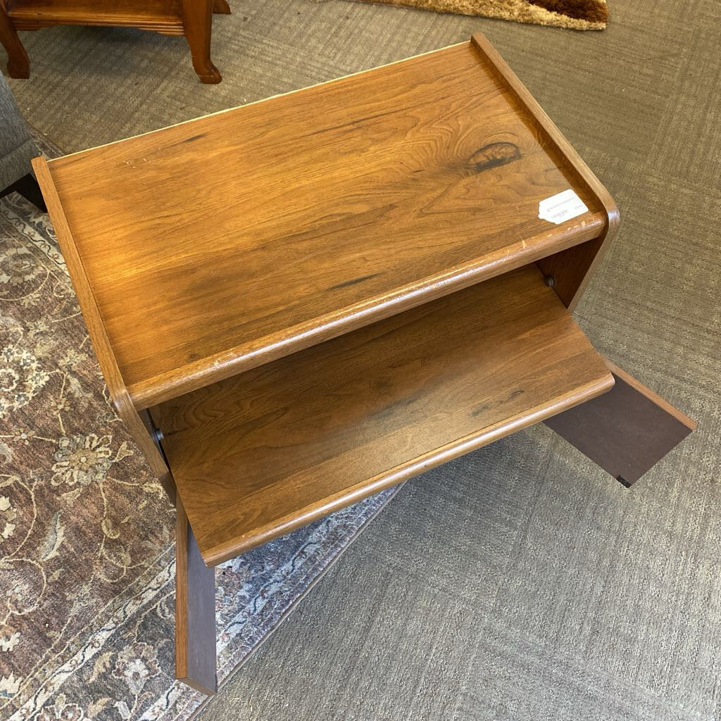 Wooden step stool on a carpeted floor