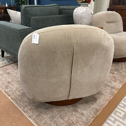 Beige ottoman with a price tag in a furniture store setting