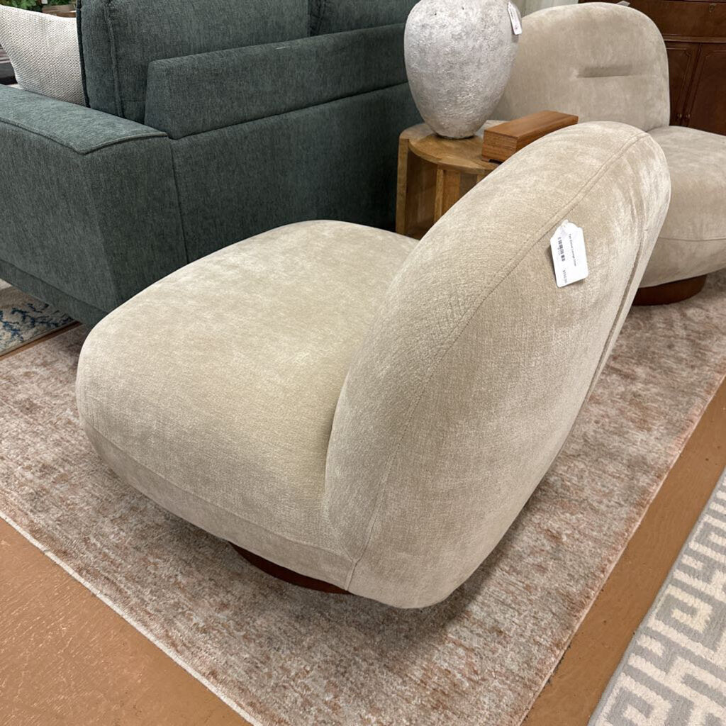 Beige armchair with a price tag in a furniture store setting