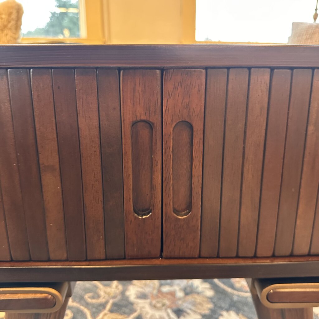 Wooden cabinet with slatted design on a blurred background
