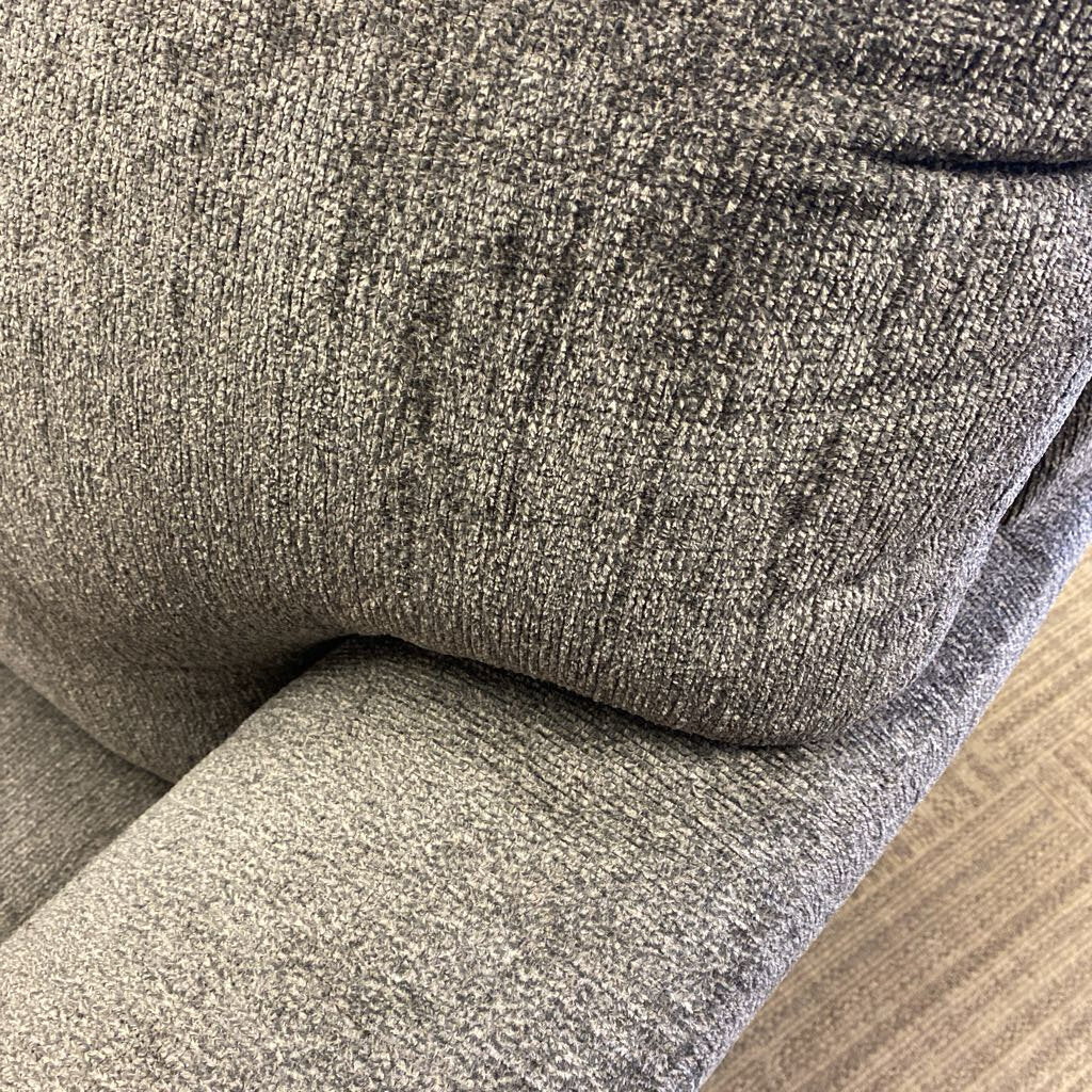 Close-up of a textured gray fabric surface
