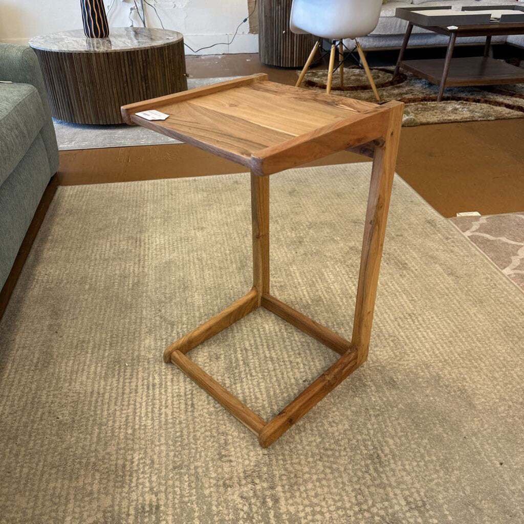 Wooden side table in a living room setting
