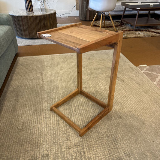 Wooden side table in a living room setting