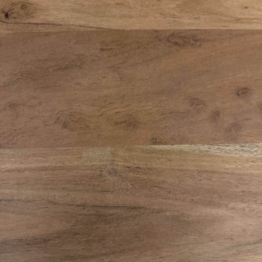 Close-up of a wooden surface with a natural brown finish