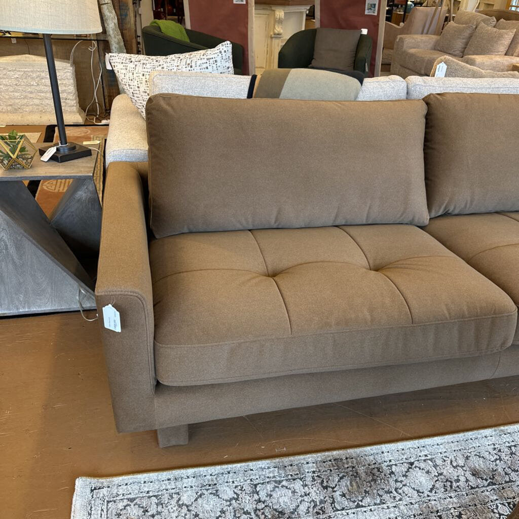 Brown sectional sofa in a furniture store setting