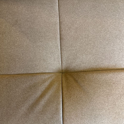 Close-up of beige tiles with a focus on texture and color.