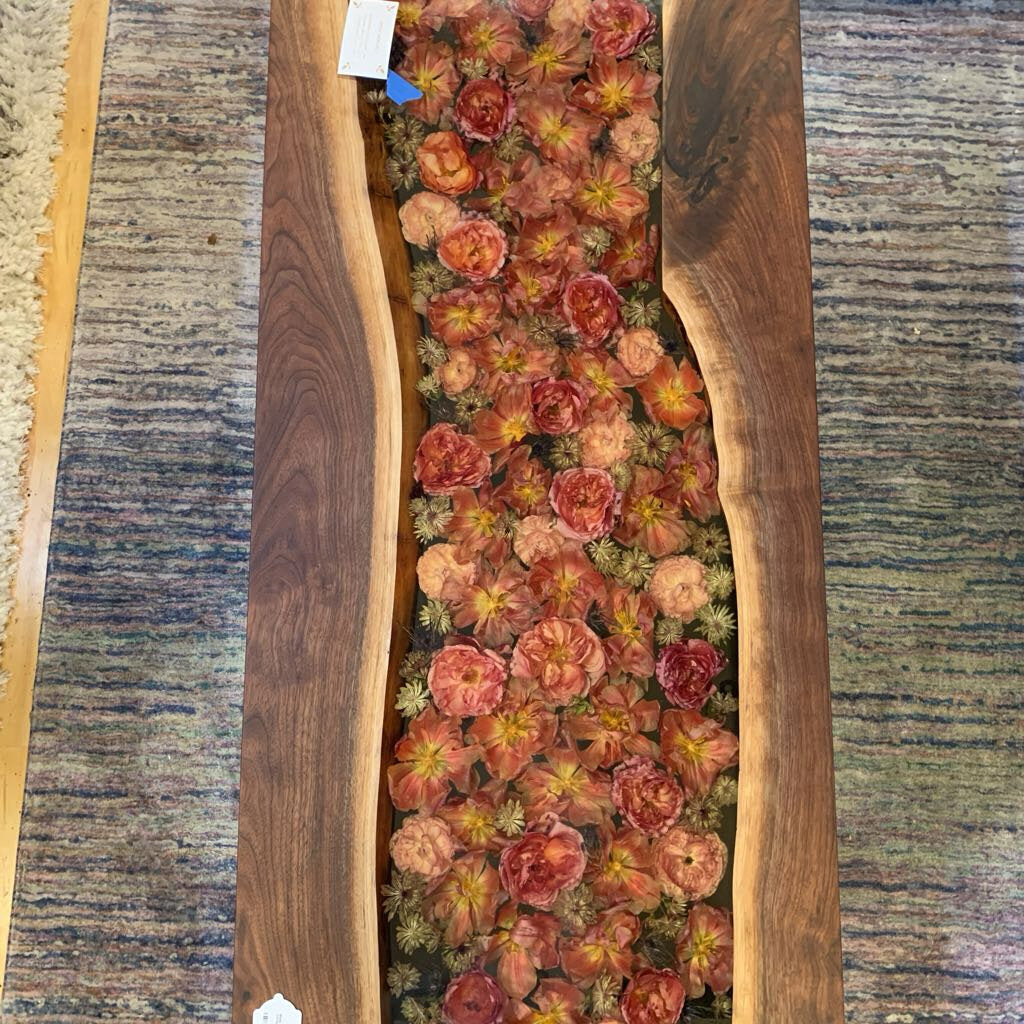 Wooden planter with succulents on a textured surface