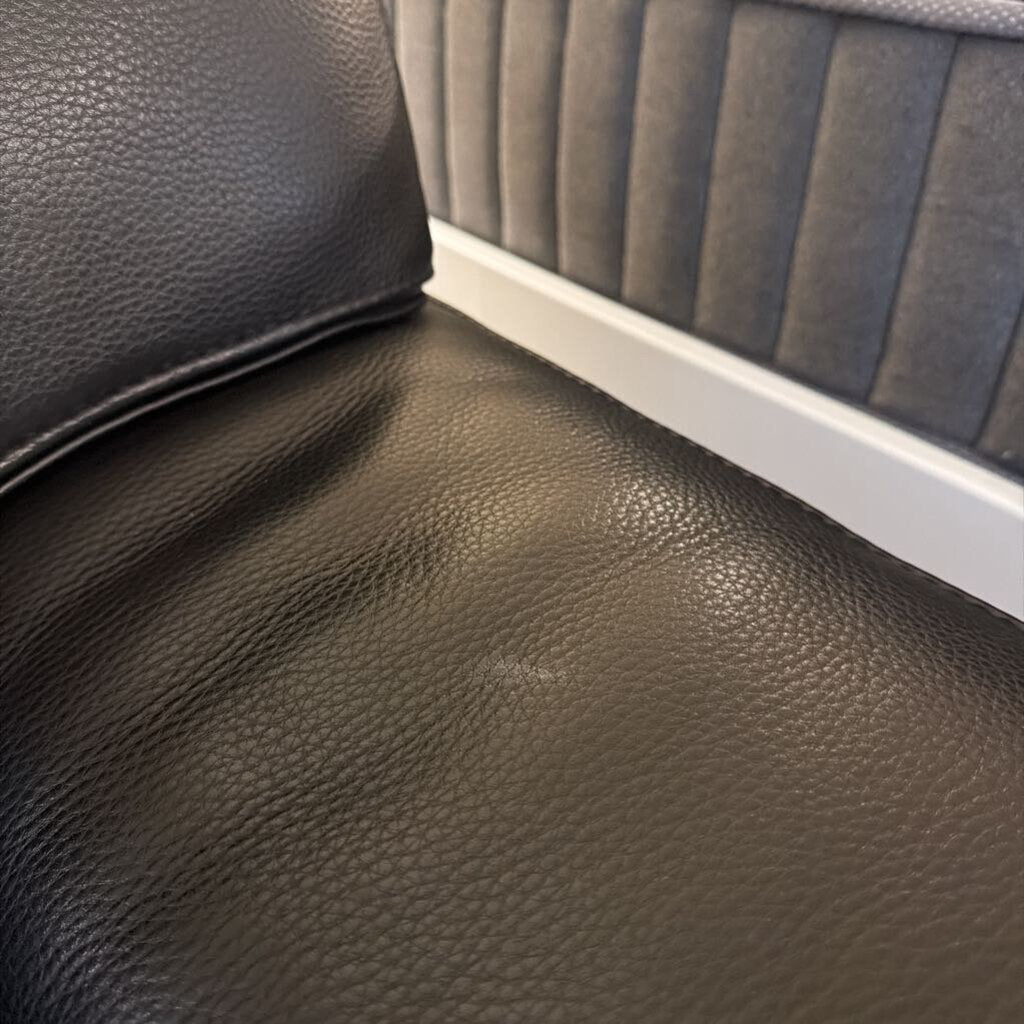 Close-up of a textured black leather surface
