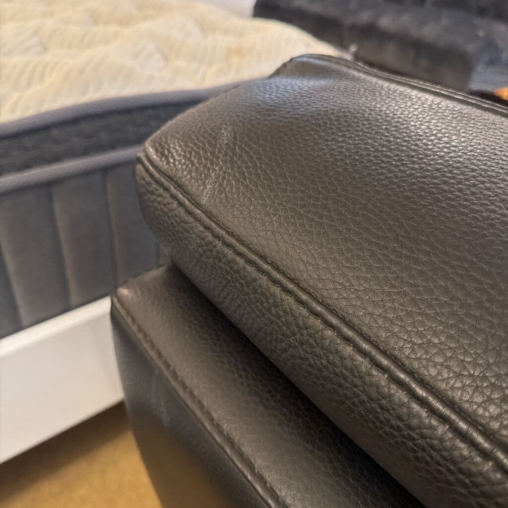 Close-up of a textured black leather seat cover