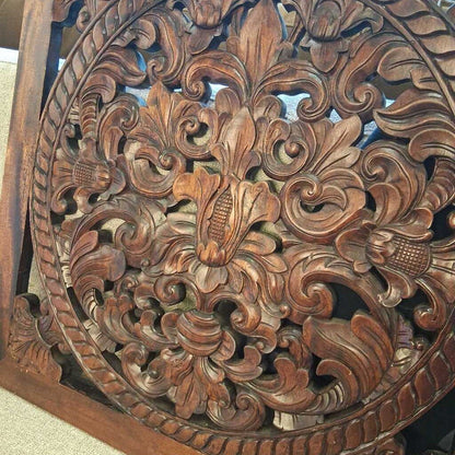 Close-up of a intricately carved wooden panel with detailed patterns
