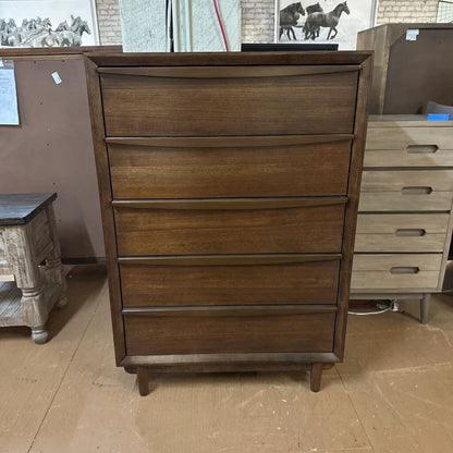 Wooden dresser with multiple drawers in a room setting