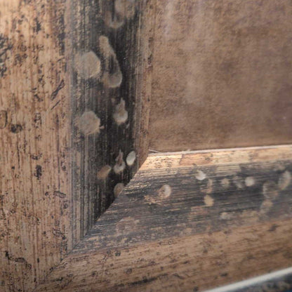 Close-up of a wooden frame with visible grain and texture