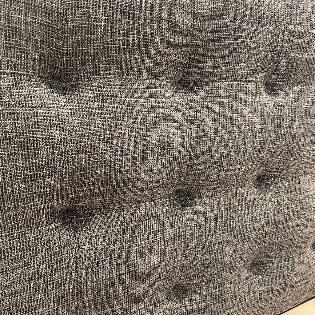 a speckled grey tufted fabric bed frame 