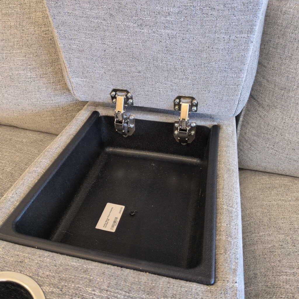 Gray upholstered chair with a black storage compartment underneath