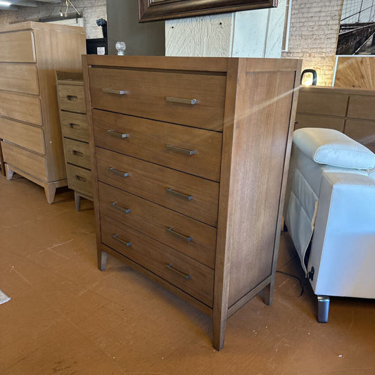 Wooden dresser with multiple drawers in a room setting