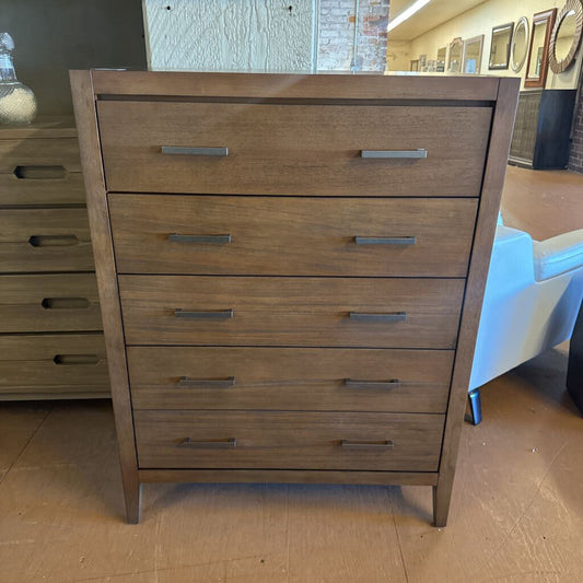 Wooden dresser with multiple drawers in a room setting