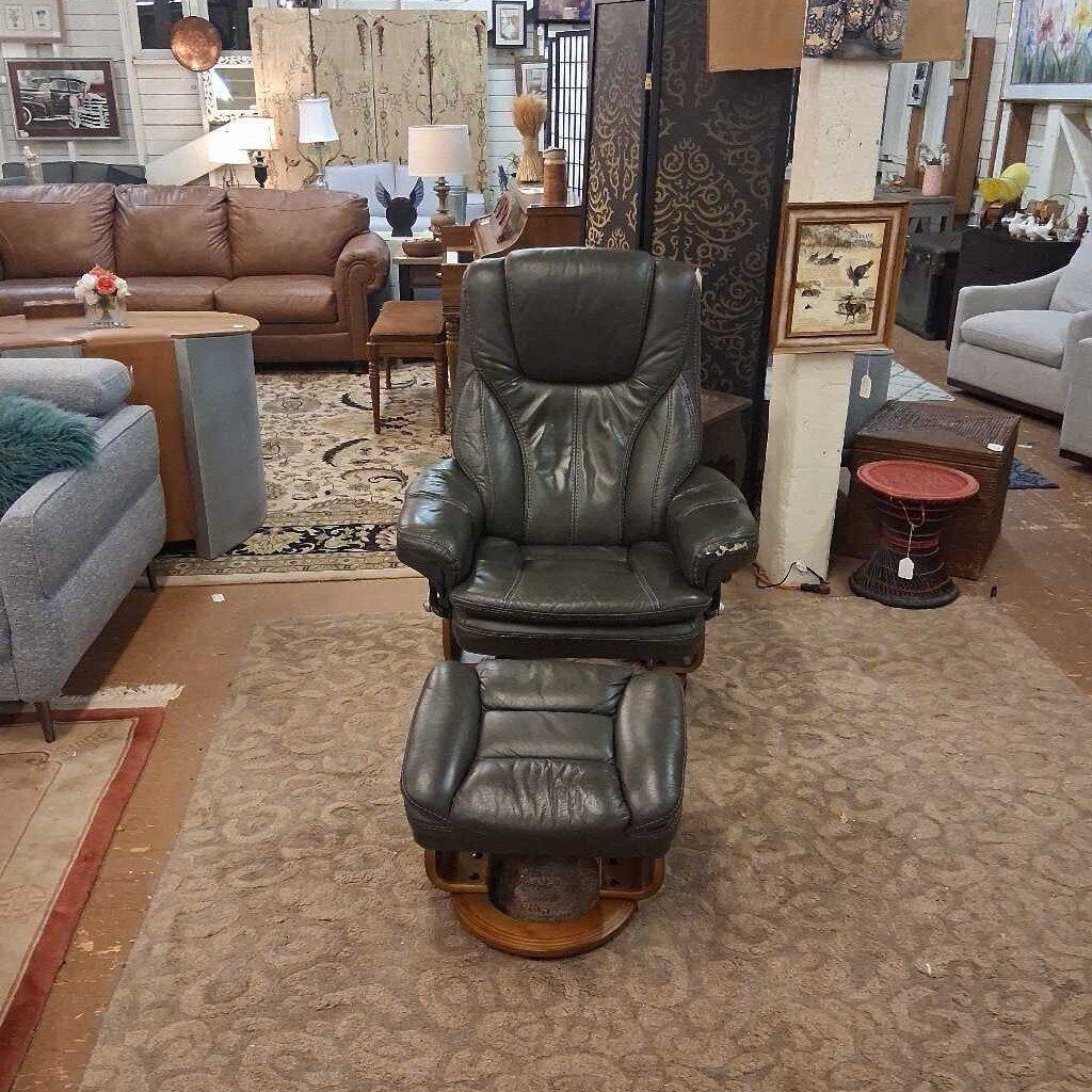 Leather recliner chair in a living room setting with furniture and decor.