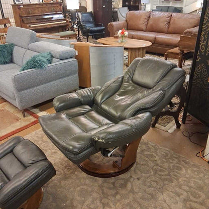 Leather recliner chair in a furniture store with other seating options and a piano in the background.