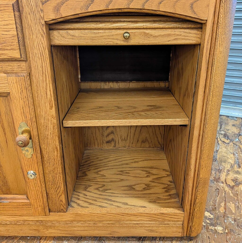 Wooden cabinet with a drawer and shelves on a wooden floor.