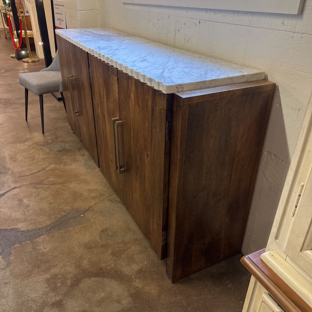 Wooden cabinet with marble countertop in a showroom setting