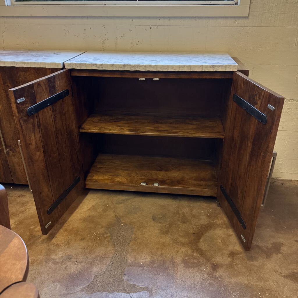 Wooden storage cabinet with open doors on a concrete floor.