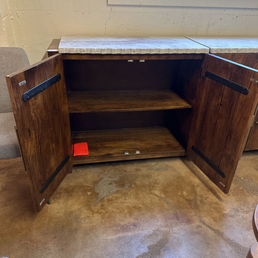 Wooden cabinet with open doors on a concrete floor.