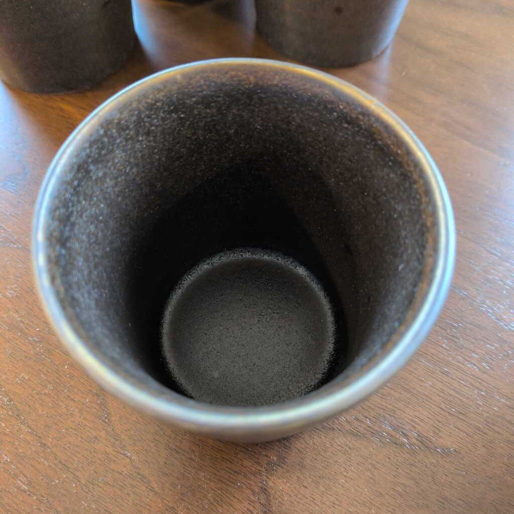 Close-up of a ceramic pot on a wooden surface