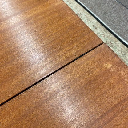 Close-up of wooden flooring with a visible grain pattern.