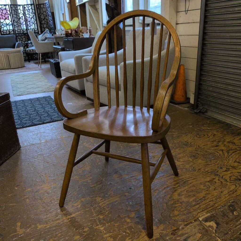 Wooden armchair in a room with furniture and decor