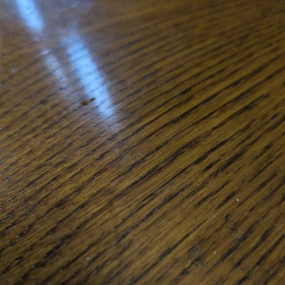 Close-up of a wooden surface with visible grain and texture