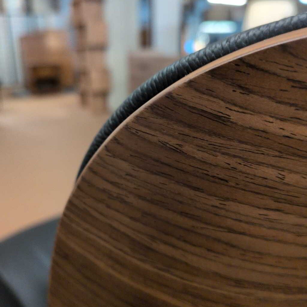 Close-up of a wooden surface with blurred indoor background