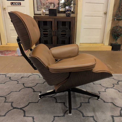 Brown lounge chair with ottoman on a patterned rug