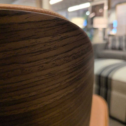 Close-up of a wooden chair with a blurred background