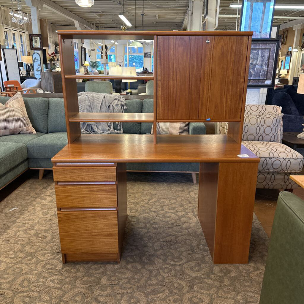 Wooden desk with shelves in a furniture store setting