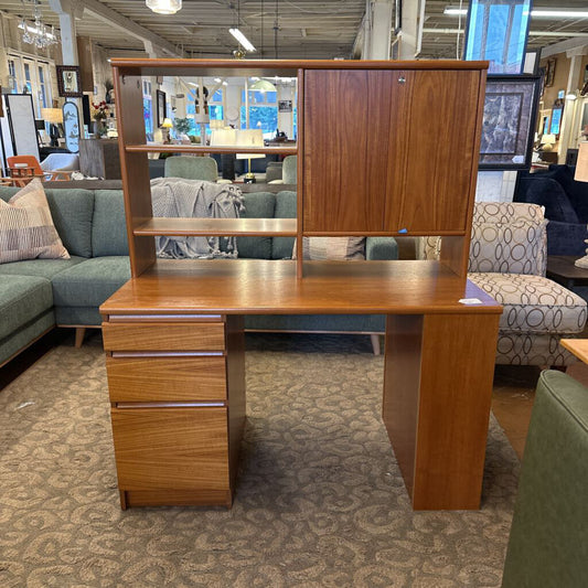 Wooden desk with shelves in a furniture store setting