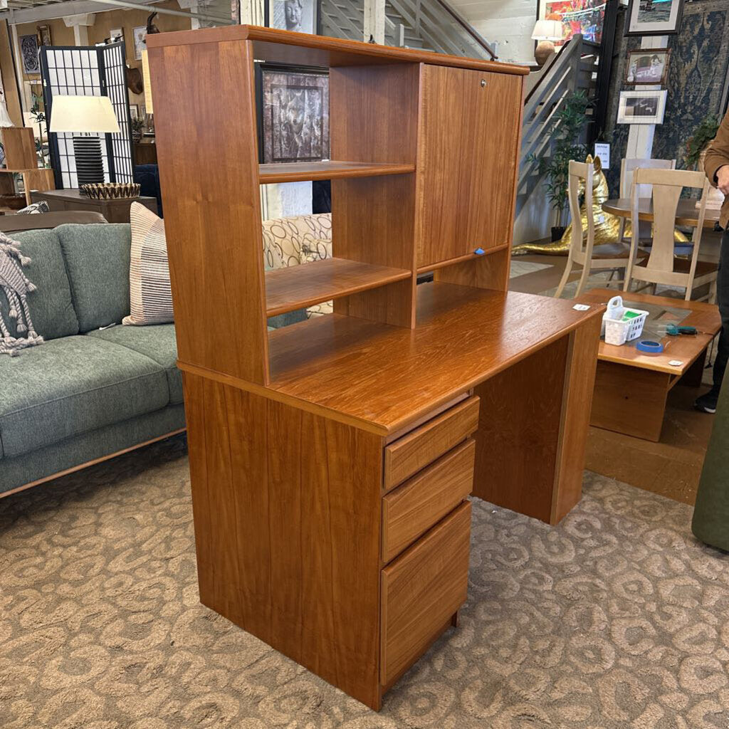 Wooden desk with shelves in a room with furniture and decor