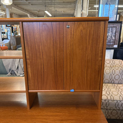 Wooden cabinet with a shelf in a store setting