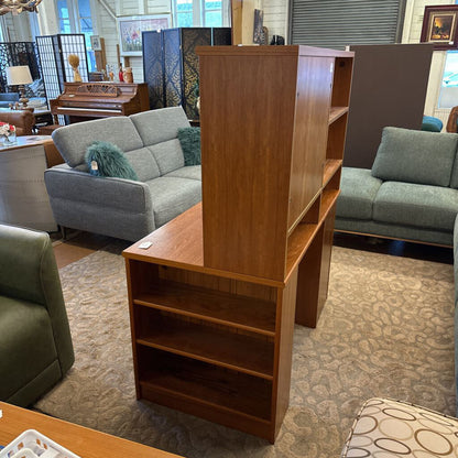 Wooden bookshelf in a room with furniture and decor