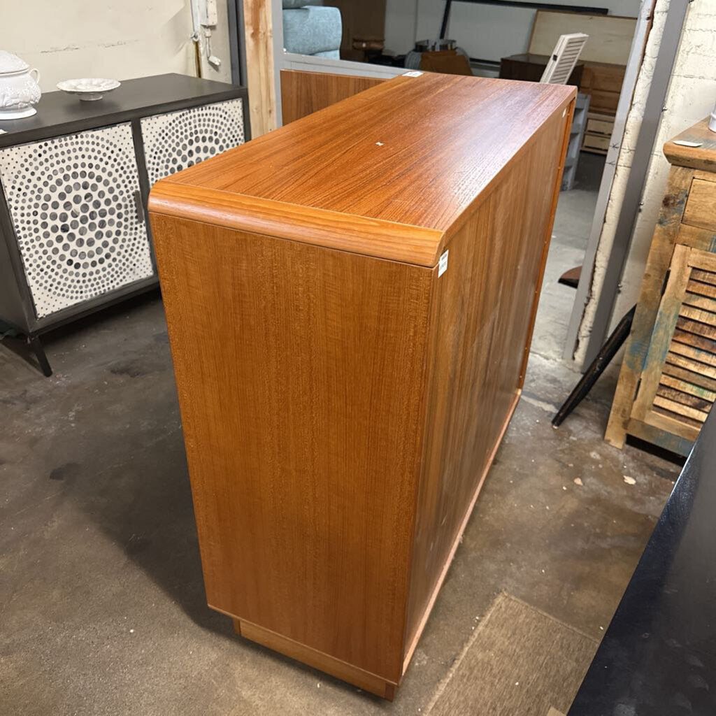 Wooden cabinet in a storage or warehouse setting