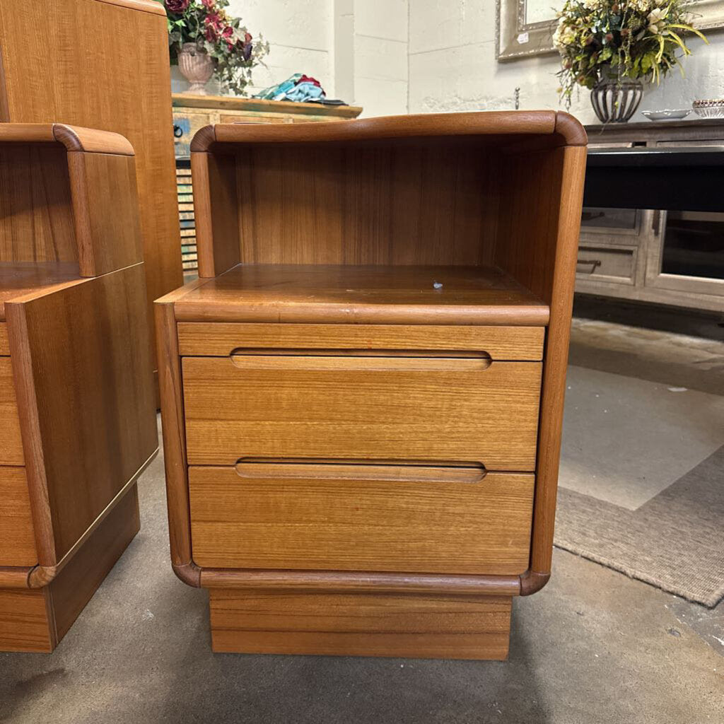 Wooden nightstand with drawers in a room setting